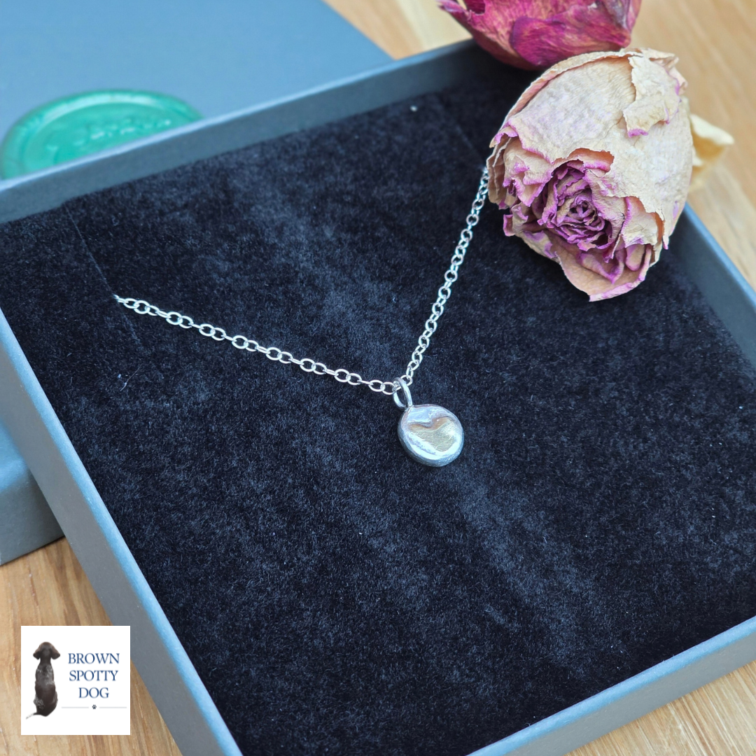 Silver Pebble Pendant with Brass Heart Detail